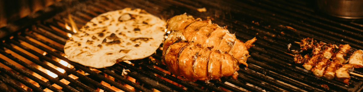 Golden fried catfish and hush puppies served at an AHEAD Catering fish fry in Shreveport, Louisiana.