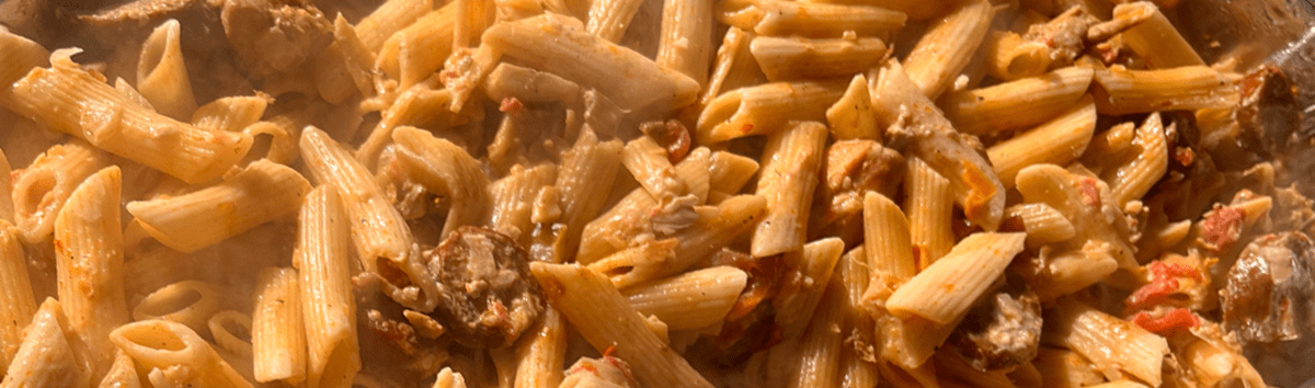 Close-up of Cajun pastalaya with sausage and chicken by AHEAD Catering in Bossier City, Louisiana.